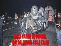 Kaza yapan otomobil mazgallarda asılı kaldı